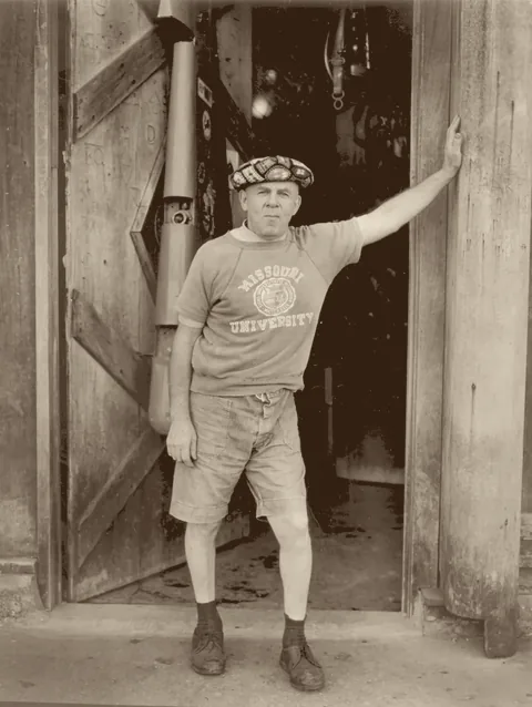 Martin 'Trader Jon' Weissman in the doorway of his bar at 511 South Palafox